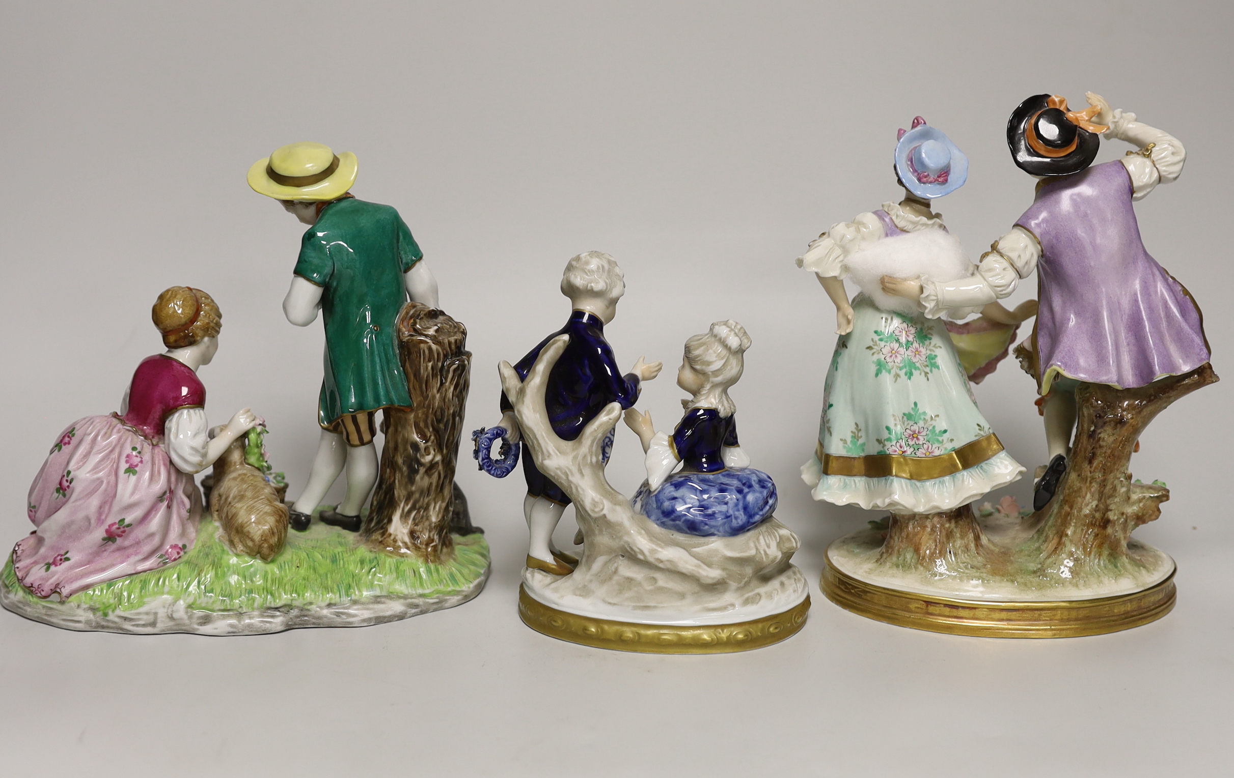 Three German porcelain figure groups, tallest 20cm high